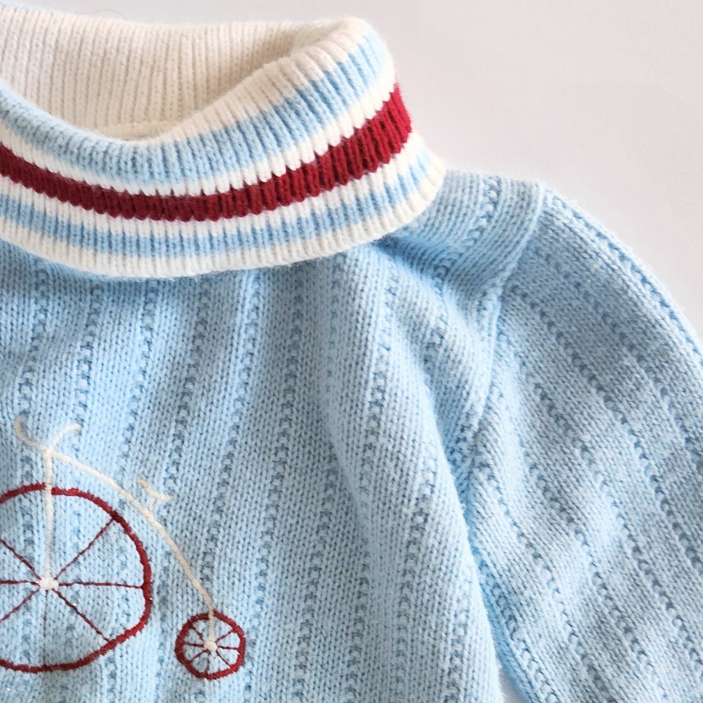 Vintage 1960s Doe Spun Toddler Turtleneck Sweater – Baby Blue with Penny Farthing Embroidery – Size 2T